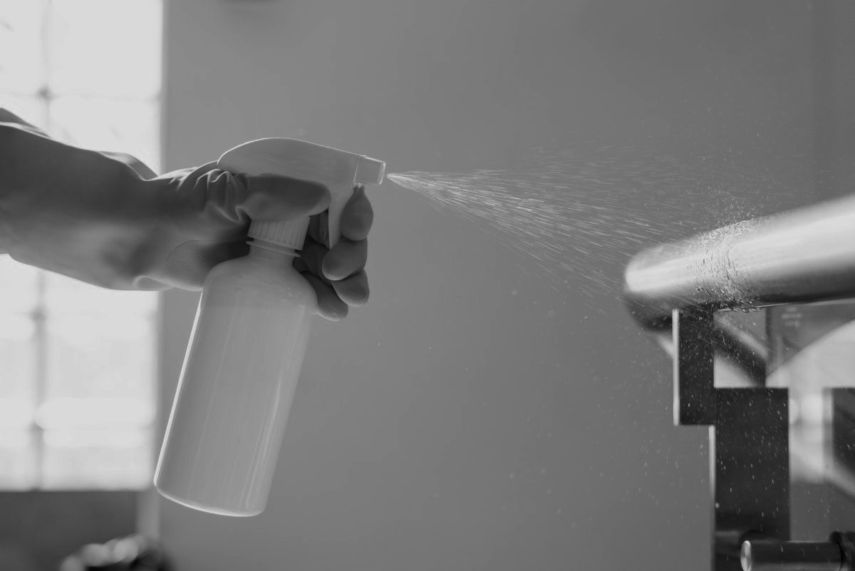 Hand cleaning steal furniture with spray