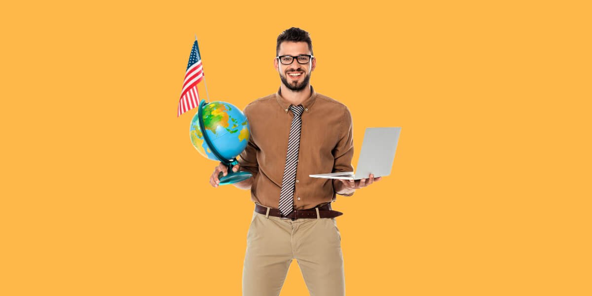 Man with globe and laptop