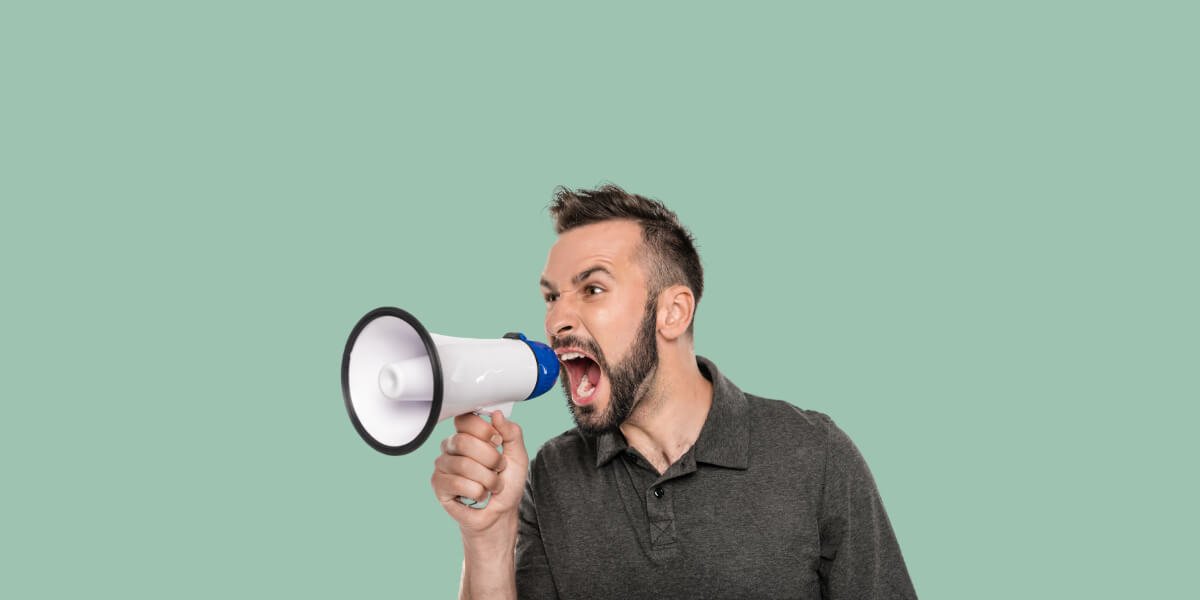 Man with megaphone that yells